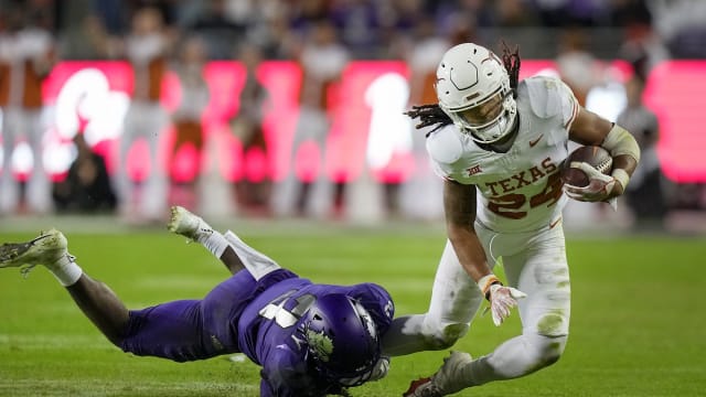 Texas Longhorns running back Jonathon Brooks (24) is pulled down by TCU Horned Frogs safety Mark Perry (3) late in the fourth quarter of an NCAA college football game, Saturday, November. 11, 2023, at Amon G. Carter Stadium in Fort Worth, Texas. Texas Longhorns running back Jonathon Brooks (24) did not return to the game after lipping off the field. Texas Longhorns won 29-26 over TCU Horned Frogs.
